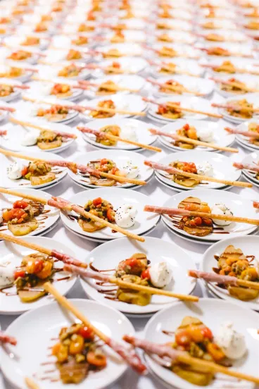 Small plates of bruschetta and antipasto arranged on table